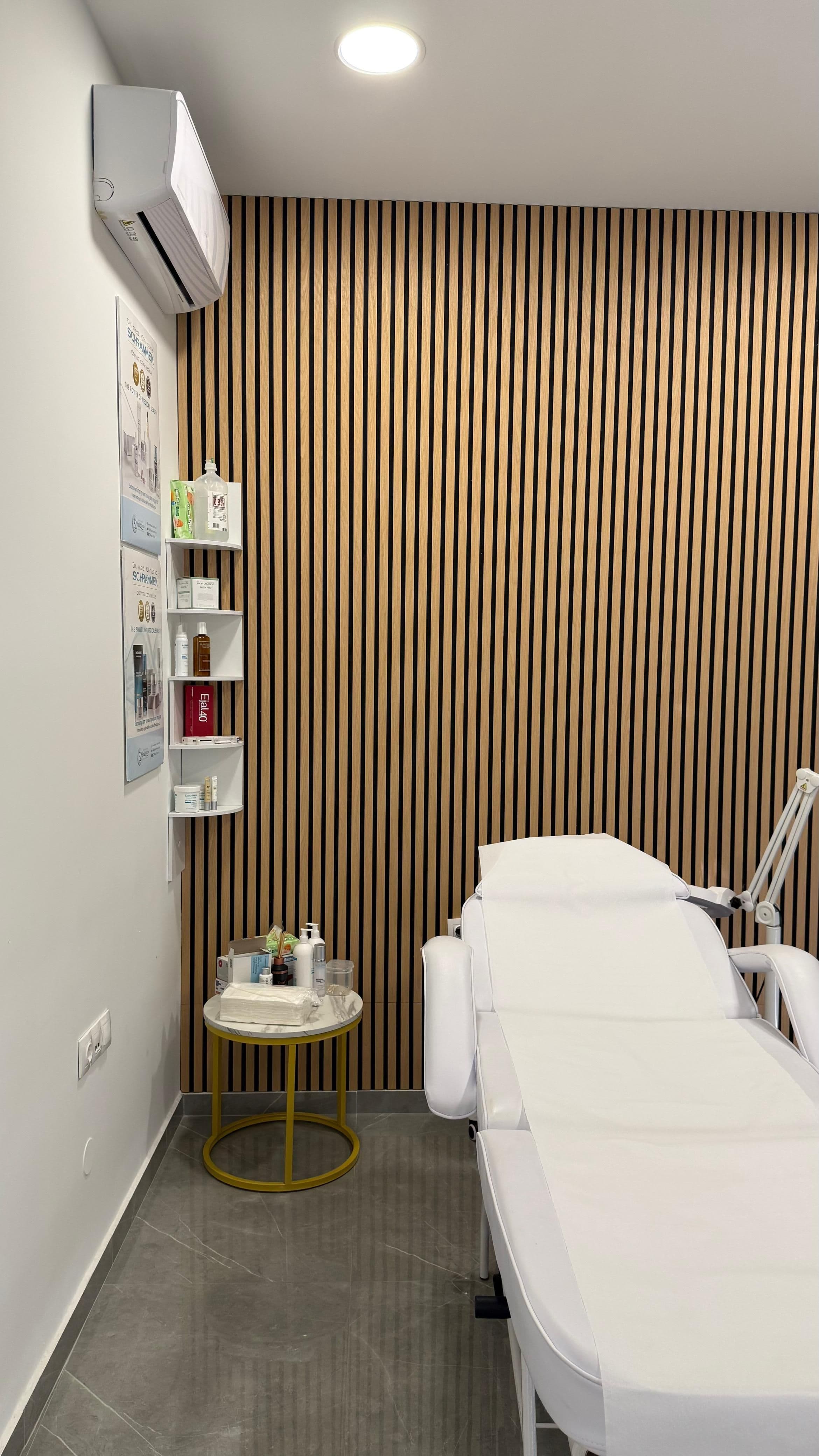 Kaiser Derma Clinic — treatment room with product display
